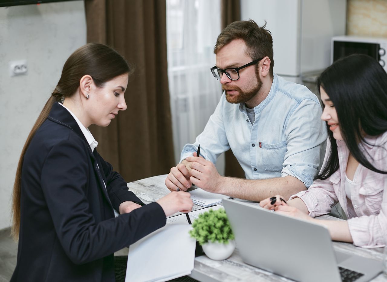 services-img A couple discusses financial documents with their advisor, highlighting investment strategies.
